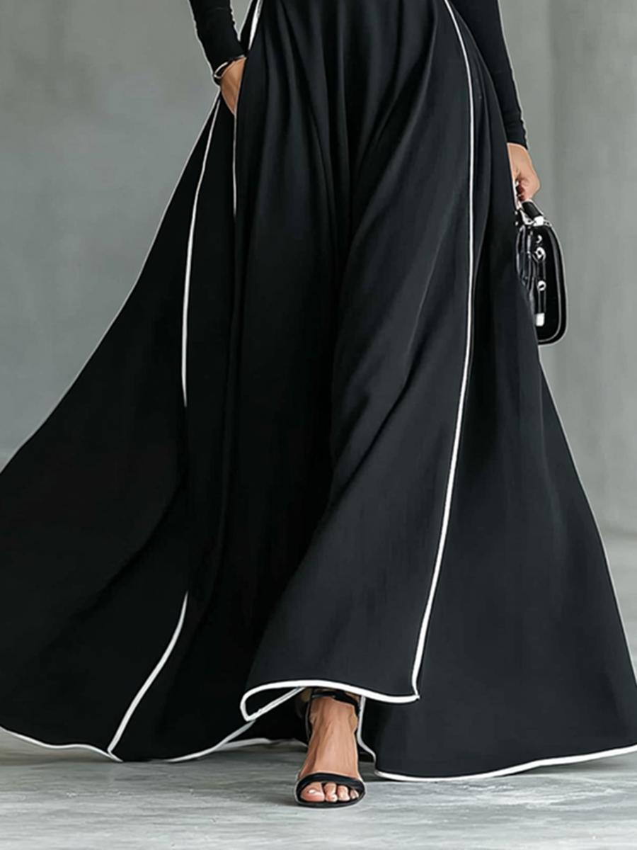 Renata – Vestido Maxi Negro con Costuras Blancas, Cuello Alto, Manga Larga y Cintura Ceñida